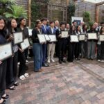 Students lined up to receive intern diploma